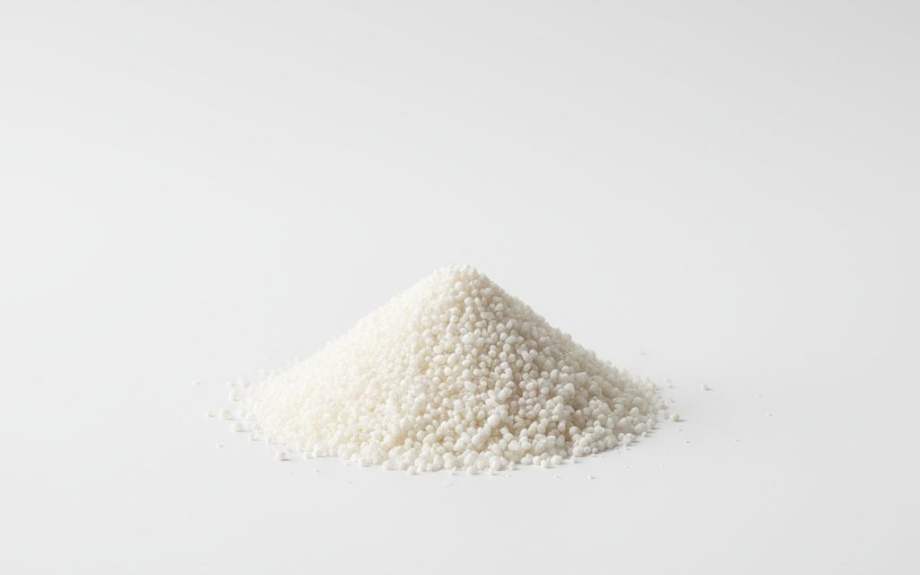 Grade confirmed at quotation — small white to off-white granules or micro-beads; creates a clear, thick, and tacky liquid when hydrated in water, studio product photograph