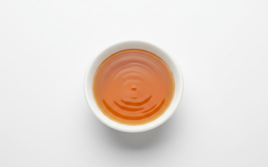 Grade confirmed at quotation — clear to hazy, amber or straw-colored liquid; composition varies but typically presented as a thin, homogeneous industrial fluid, studio product photograph
