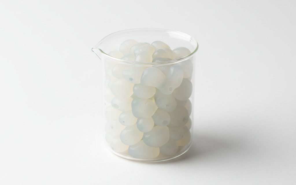 Grade confirmed at quotation — soft, rubbery translucent pellets that are slightly tacky to the touch and highly flexible in a dish, studio product photograph