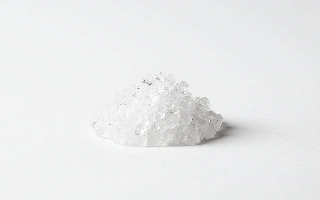 Grade confirmed at quotation — odourless, water-white pharmaceutical grade oil or aerosol spray, exhibiting a clean, non-staining, and low-friction liquid texture for incidental food contact, studio product photograph