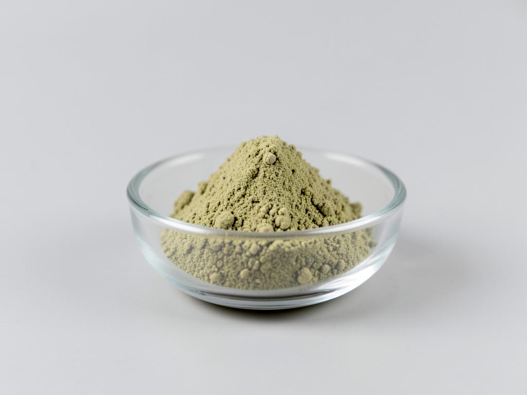 Gotu Kola Extract shown as a fine concentrated extract powder in a shallow dish in a neutral studio photograph