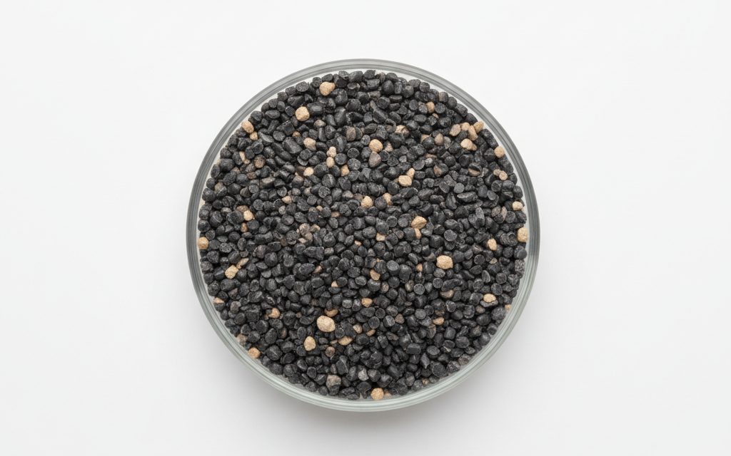 Grade confirmed at quotation — robust, dark grey or natural colored thermoplastic pellets designed to remain stable and non-charred at extreme process temperatures, studio product photograph