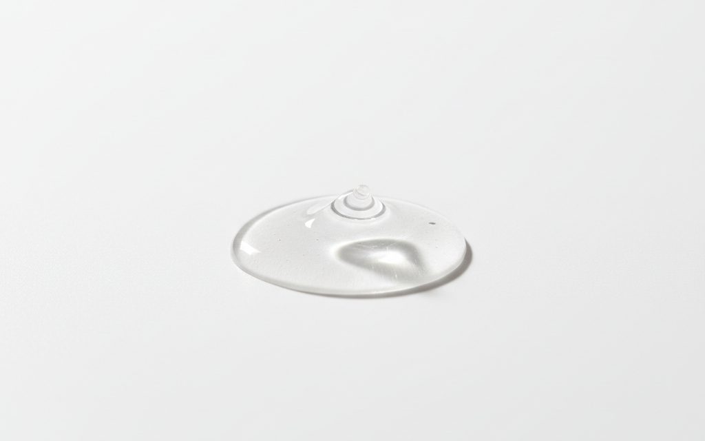 Grade confirmed at quotation — clear, colorless liquid with a slightly sharp odor and water-like viscosity, typically traded in aqueous solutions, studio product photograph
