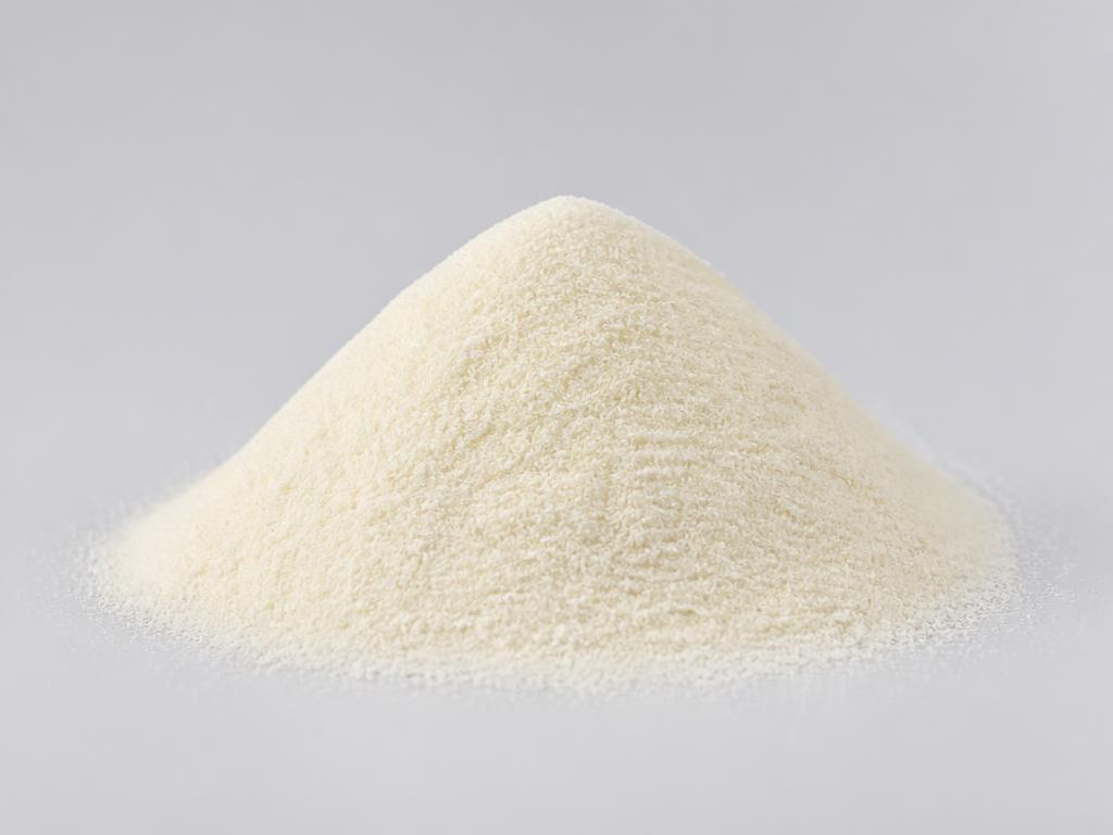 Hydrolyzed pea protein shown as a fine pale ivory powder heap in a neutral studio photograph