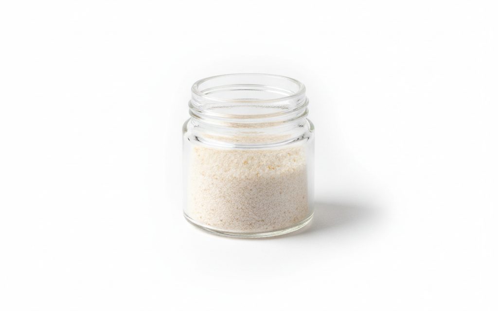 Grade confirmed at quotation — white to light tan granular powder, free-flowing and odorless, appearing similar to fine sawdust or refined white sugar, studio product photograph