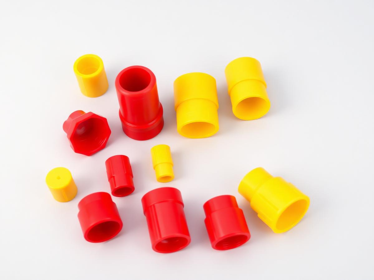 Red and yellow industrial plastic protective caps and plugs — product illustration