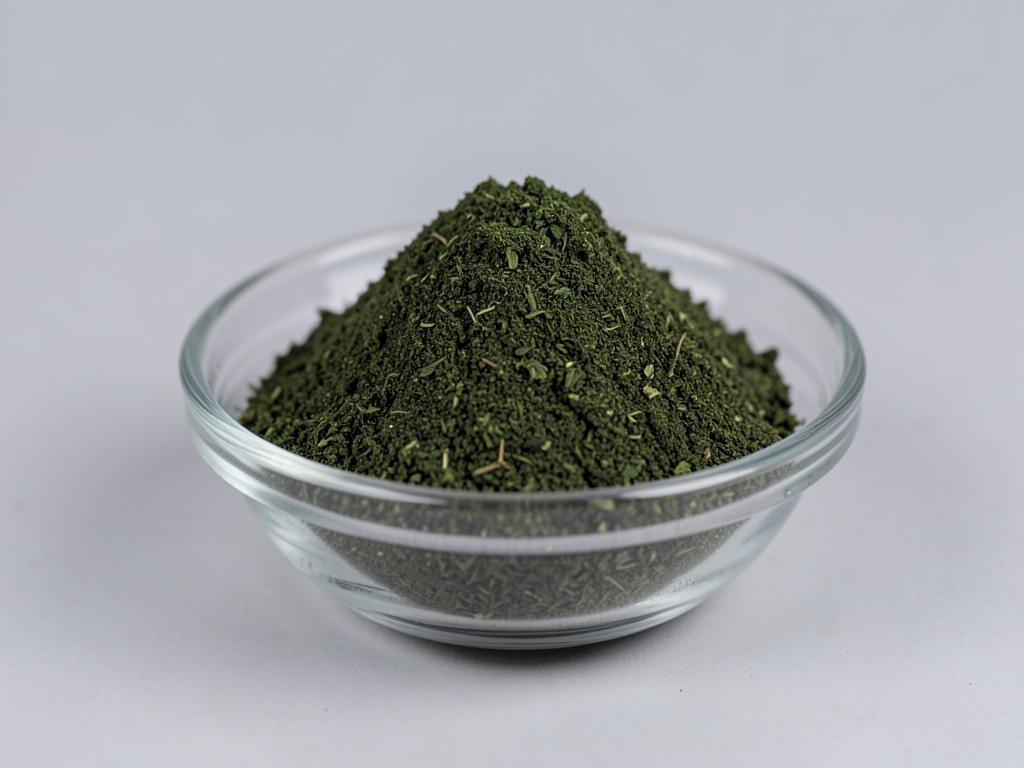 Kale Powder shown as a fine dried fruit or vegetable powder in a shallow dish in a neutral studio photograph