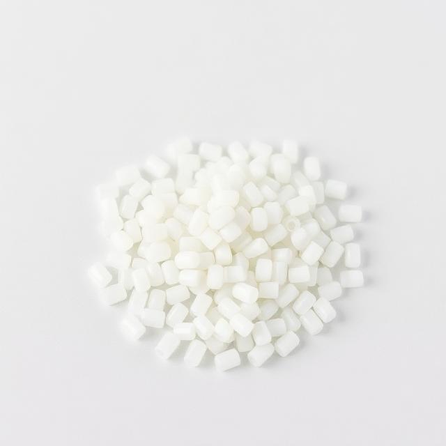 PET toughening masterbatch pellets shown as a neutral studio product photograph