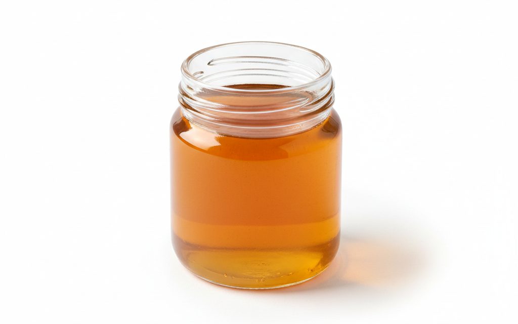 PolyDADMAC — clear to slightly amber, high-viscosity liquid with a faint amine odor; appears as a thick syrup in glass beakers, studio product photograph