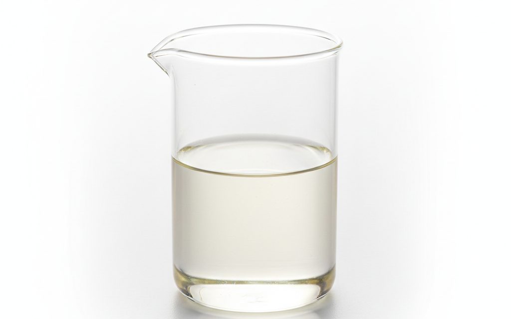Propionic Acid — clear, colorless to light yellow oily liquid with a sharp, pungent, and sour odor, presented as a free-flowing fluid, studio product photograph