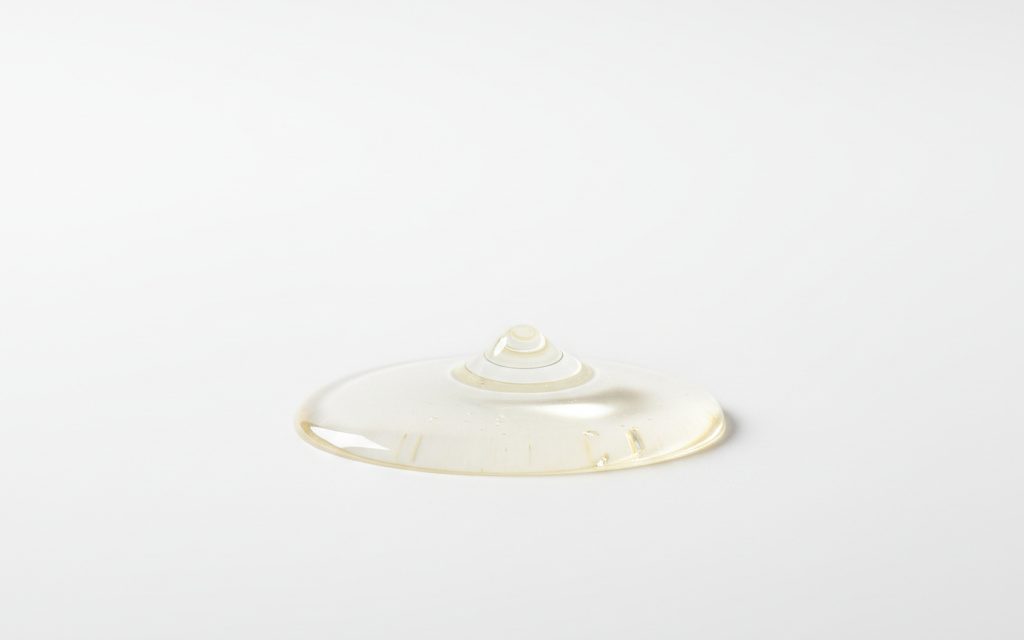 Grade confirmed at quotation — clear, colorless to straw-colored aqueous liquid with a slightly acidic or neutral odor, free from visible suspended solids, studio product photograph