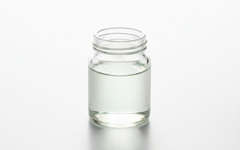Grade confirmed at quotation — clear colorless to slightly greenish liquid, often featuring a pungent or sharp odor characteristic of non-oxidizing antimicrobial agents, studio product photograph