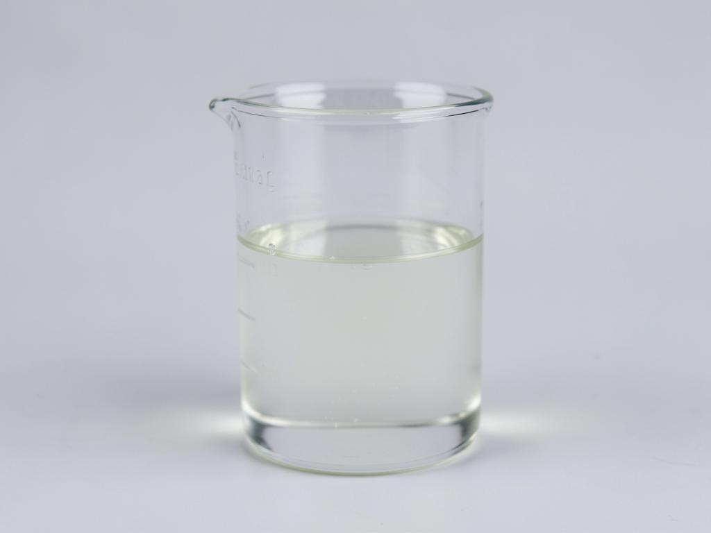 Sodium lactate shown as a clear slightly viscous solution in a glass laboratory beaker in a neutral studio photograph