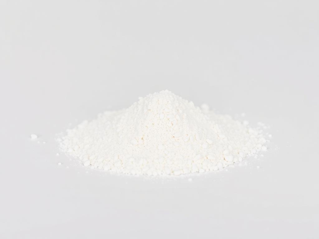 Sodium Stearoyl Lactylate (SSL) shown as a neutral studio product photograph of the bulk material