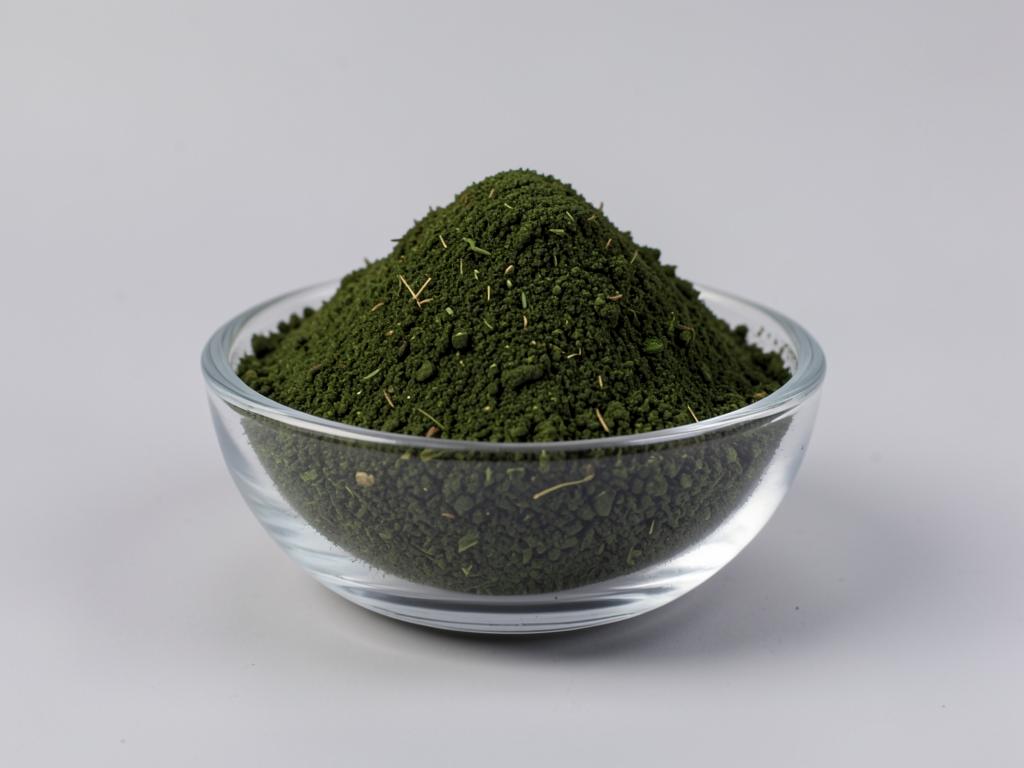 Spinach Leaf Powder shown as a fine dried fruit or vegetable powder in a shallow dish in a neutral studio photograph